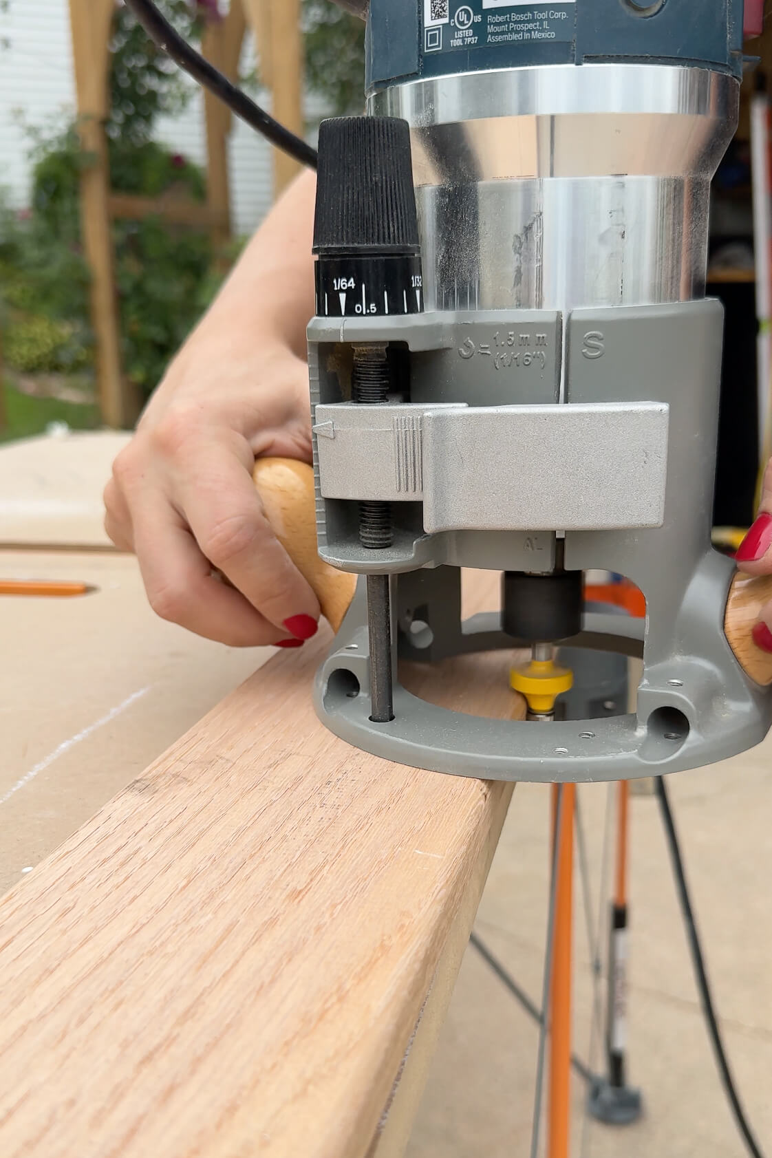 Using a router to round the edges of a ladder for a kids bunk bed.